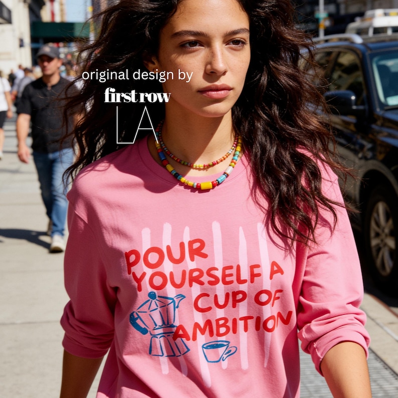 Woman wearing Dolly Parton Pour Yourself a Cup of Ambition Shirt, Retro Coffee T, 9 to 5 Country Music Tee, Moka Pot, Coffee Club, Long Sleeve T-Shirt.

Original design and copyright by first row LA 2025.