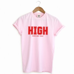 Blossom Light Pink T-shirt with the text HIGH how are you? in Red College font

HIGH How Are You? Funny Stoner Shirt, Red College Font Tee, Weed Humor Graphic Tee, 420 Shirt, Chill Vibes T-Shirt, Unisex Gift, Cannabis T