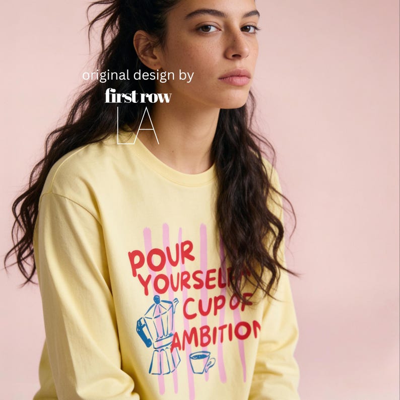 Woman wearing Dolly Parton Pour Yourself a Cup of Ambition Shirt, Retro Coffee T, 9 to 5 Country Music Tee, Moka Pot, Coffee Club, Long Sleeve T-Shirt.

Original design and copyright by first row LA 2025.
