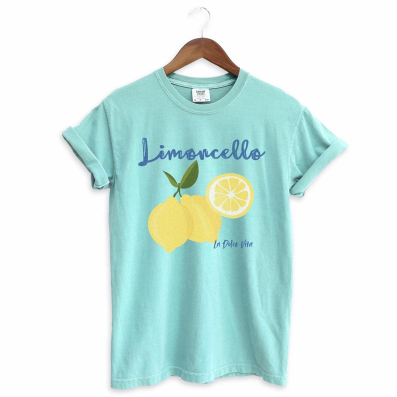 Chalky Mint T-shirt with the text Limoncello, La Dolce Vita, follewed by a juicy lemon graphics.
Limoncello Shirt, La Dolce Vita Tee, Lemon Shirt, Amalfi Coast, Italy TShirt, Vacay T-Shirt, Lemons Tee, Cocktail T Shirt, Retro Graphic Tee