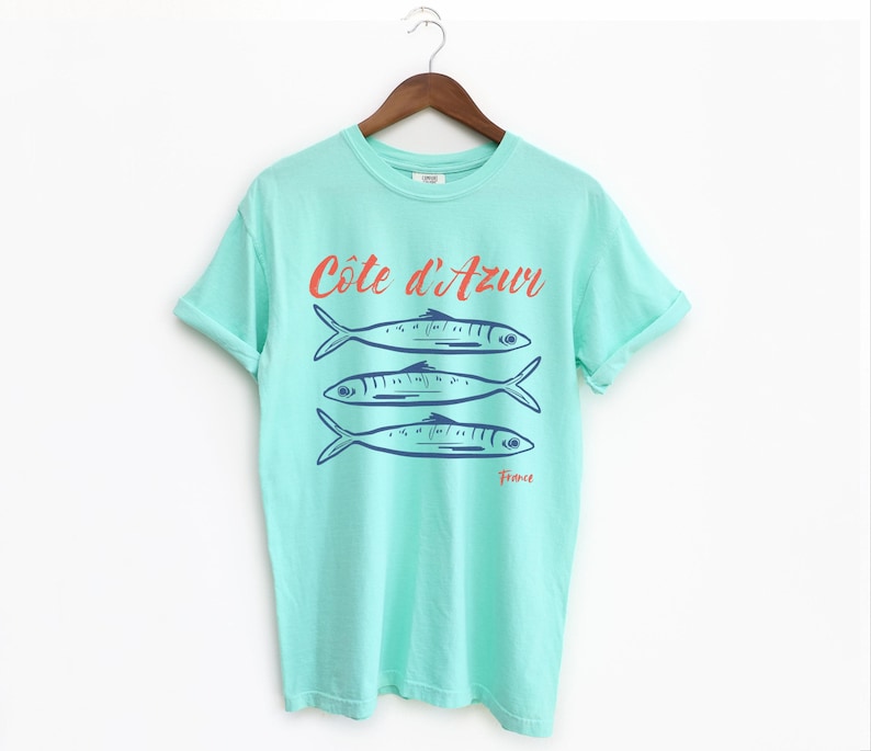Island Reef T-shirt with the text Côtes d'Azur, France.

Côtes d'Azur France T-Shirt, Old Money Aesthetic, 3 Fish , French Riviera, Heritage, Sardines TShirt, France Travel Tee, Coastal Aesthetic, Retro Graphic Tee, French Vacation, Mediterranean
