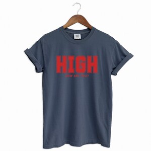 Navy Blue T-shirt with the text HIGH how are you? in Red College font

HIGH How Are You? Funny Stoner Shirt, Red College Font Tee, Weed Humor Graphic Tee, 420 Shirt, Chill Vibes T-Shirt, Unisex Gift, Cannabis T