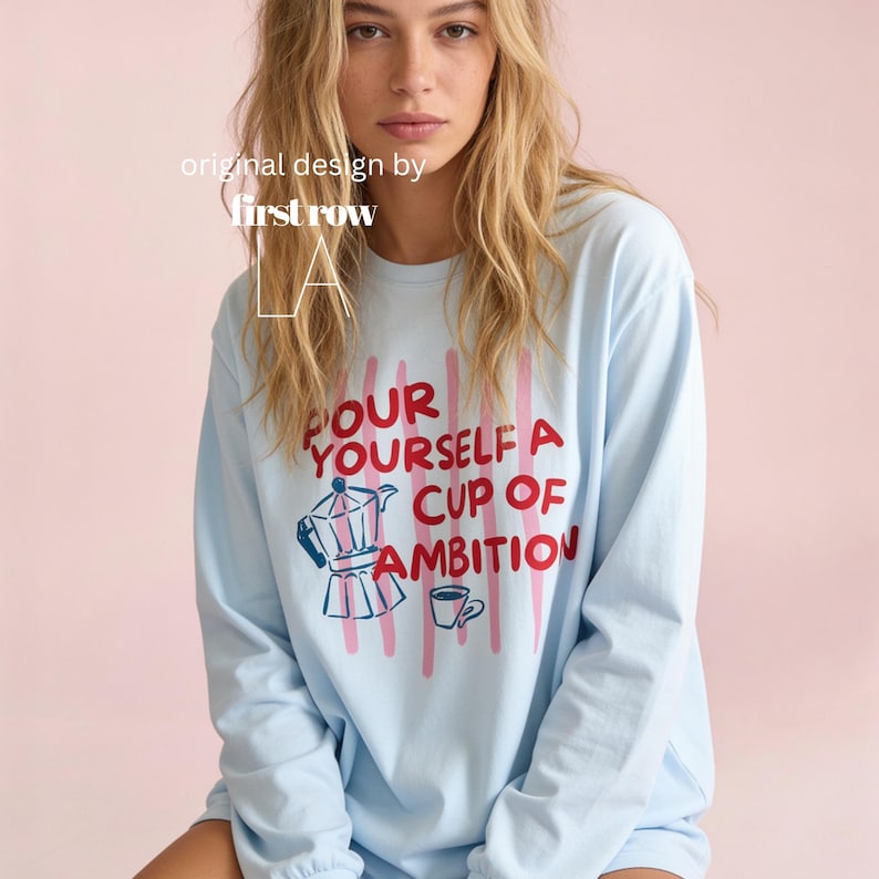 Woman wearing Dolly Parton Pour Yourself a Cup of Ambition Shirt, Retro Coffee T, 9 to 5 Country Music Tee, Moka Pot, Coffee Club, Long Sleeve T-Shirt.

Original design and copyright by first row LA 2025.