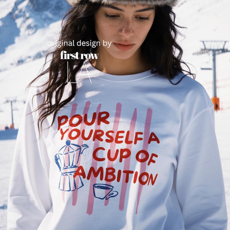 Woman wearing Dolly Parton Pour Yourself a Cup of Ambition Shirt, Retro Coffee T, 9 to 5 Country Music Tee, Moka Pot, Coffee Club, Long Sleeve T-Shirt.

Original design and copyright by first row LA 2025.