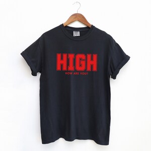 Black T-shirt with the text HIGH how are you? in Red College font

HIGH How Are You? Funny Stoner Shirt, Red College Font Tee, Weed Humor Graphic Tee, 420 Shirt, Chill Vibes T-Shirt, Unisex Gift, Cannabis T