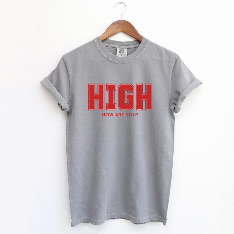 Grey T-shirt with the text HIGH how are you? in Red College font

HIGH How Are You? Funny Stoner Shirt, Red College Font Tee, Weed Humor Graphic Tee, 420 Shirt, Chill Vibes T-Shirt, Unisex Gift, Cannabis T