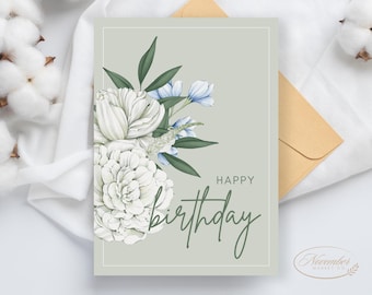 Könnte beinhalten: Geburtstagskarte mit floralem Design. Die Karte zeigt weiße Blumen, blaue Akzente und grüne Blätter auf hellgrünem Hintergrund. Die Worte "Happy Birthday" sind in einer Schreibschrift geschrieben. Ein Umschlag ist sichtbar.