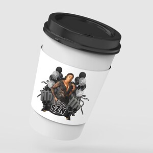 May include: A white disposable coffee cup with a black lid featuring a graphic print of a person in a black lace outfit surrounded by black and silver glitter balloons and ribbons, with the text Virgo SZN printed in a bold white font.
