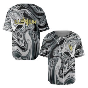 May include: Two baseball jerseys with a swirling black, white, and gray pattern. One jersey has the word "ILLENIUM" in gold lettering across the chest. The other jersey has a gold emblem on the chest. Both jerseys have white trim.
