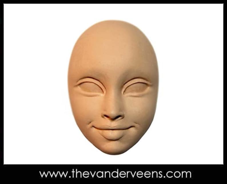 May include: A close-up of a plain, light brown, sculpted face with closed eyes and a slightly smiling mouth.