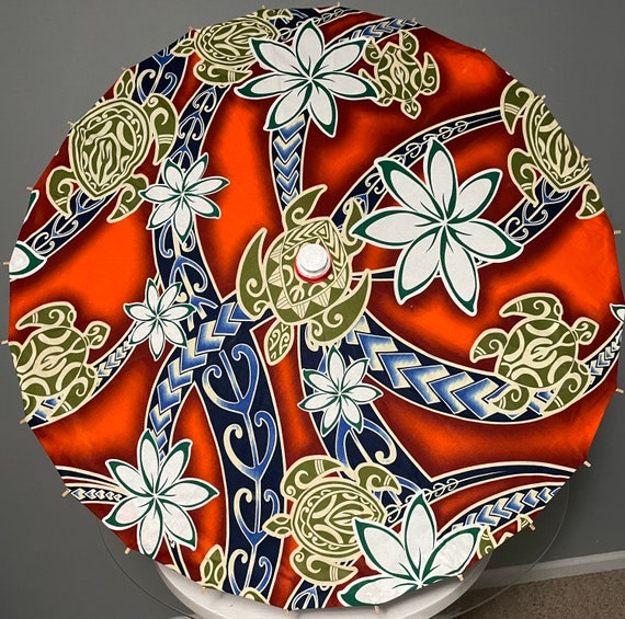 Orange polynesian design with turtles parasol