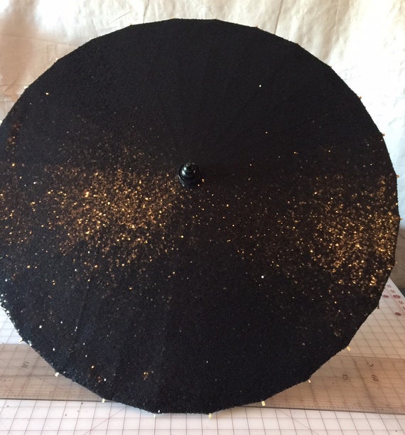 Black sequins on a black parasol