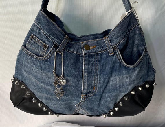up cycled denim and leather purse with cone shaped metal studs