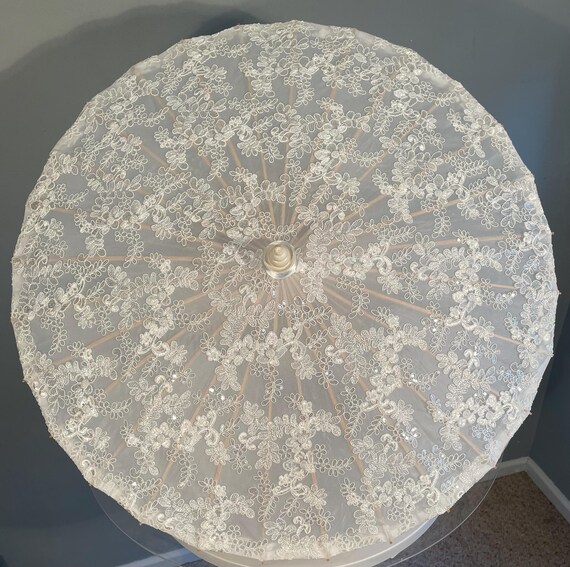 White lace and sequin parasol