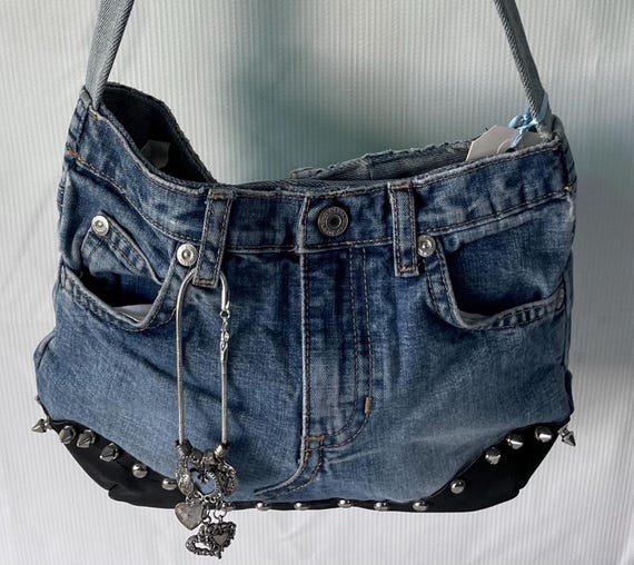 up cycled denim and leather purse with studs and spikes