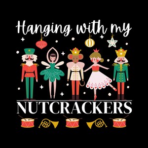 May include: A black graphic with the text "Hanging with my Nutcrackers" above a line of cartoon characters. The characters include a nutcracker, a ballerina, a mouse king, and a ballerina. Below are drums and horns.
