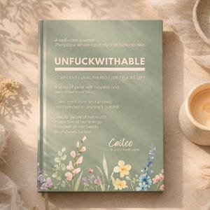 May include: A sage green self-care journal with the word "UNFUCKWITHABLE" in bold white letters. The cover features floral illustrations and text that reads "A self-care journal" and "CONFIDENT | UNBOTHERED | ZERO FUCKS LEFT". The journal is designed to promote self-respect and zero-tolerance.