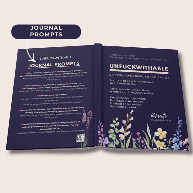 May include: An open self-care journal with the title "UNFUCKWITHABLE" and the words "JOURNAL PROMPTS" on the left page. The right page has text about self-respect and zero-tolerance. Floral illustrations decorate the pages.