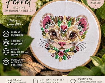 May include: A circular wooden embroidery hoop containing a white fabric panel with a detailed machine embroidery design of a ferret face surrounded by colorful floral and leaf patterns in shades of pink, green, yellow, and brown.