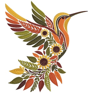 May include: An embroidered hummingbird design in autumn colors. The bird's wings and body are filled with leaves and sunflowers in shades of orange, yellow, green, and brown. The hummingbird is depicted in flight against a white background.