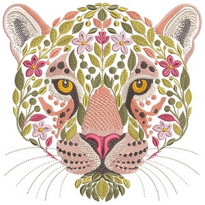 May include: Embroidered design of a leopard's face, featuring intricate floral and leaf patterns. The leopard's face is in shades of pink, tan, and brown, with yellow eyes. The floral elements include pink flowers and green leaves, creating a detailed and artistic design.