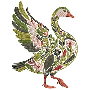 May include: An embroidered design of a goose with open wings, filled with floral and leaf patterns. The goose features a red beak and feet, with a body adorned in shades of green, white, and pink. The design is set against a white background.