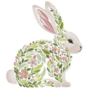 Puede incluir: Diseño bordado de un conejo blanco con detalles florales rosas y verdes. El conejo está rodeado de hojas y flores, creando un patrón delicado e intrincado.