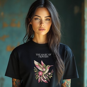 Floral hummingbird machine embroidery design with pink flowers, green leaves, cream feathers and botanical branches.