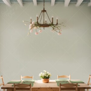 May include: A wooden dining table with four chairs, a floral centerpiece, and a chandelier with pink flowers hanging from the ceiling.