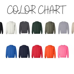 May include: Color chart showing 12 different sweatshirt colors. The colors are black, white, gray, green, olive, light gray, blue, navy, red, orange, pink, and beige.