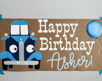 Petite bannière en papier brun peinte à la main de camion bleu