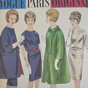 May include: A Vogue Paris Original sewing pattern envelope featuring illustrations of four outfits. The designs include a navy blue coat and dress, a green coat, and a patterned two-piece set. The text reads Vogue Paris Original, printed pattern 1106, Designed by Grès.