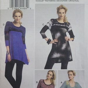 May include: A sewing pattern for a women's top with four different styles. The pattern includes a black and white patterned top, a blue and black striped top, a pink and black striped top, and a blue and white patterned top. The pattern is from Vogue Patterns and is designed by Katherine Tilton.