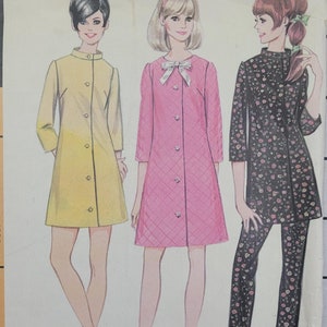 May include: A vintage sewing pattern featuring three different dress designs. The first dress is yellow, the second is pink, and the third is black with a floral print. The pattern includes instructions for making a dress, pants, and a top.
