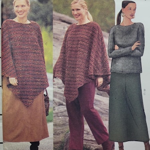 May include: Three women's fashion sewing patterns. The patterns are for a poncho, a long skirt, and a sweater. The patterns are printed on white paper with black text and illustrations.