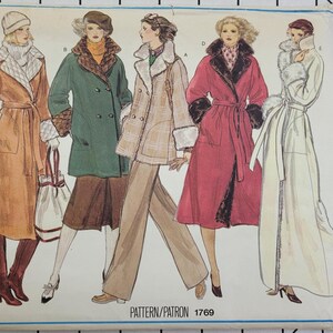 May include: Vogue's Basic Design sewing pattern featuring illustrations of five different coat designs. The coats are in various colors, including brown, green, red, and white, with fur trim and belted or buttoned closures. The pattern number is 1769.
