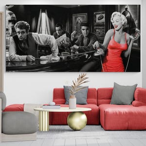 May include: A black and white photo of four people in a bar setting. The woman in the photo is wearing a red dress and holding a phone. The men are all wearing suits and ties. The photo is framed and hanging on a wall.