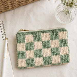 Sage green checkered crochet purse styled with a notebook and dried flowers