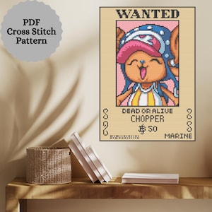 May include: A cross-stitch pattern depicting a "Wanted" poster of the character Chopper from One Piece. The poster reads "DEAD OR ALIVE CHOPPER £50 MARINE" and is set within a light beige border. The words "PDF Cross Stitch Pattern" are also visible.