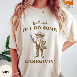 Funny Nurse Shirt, Retro Western Caregiver Nurse Gift, Registered Nurse T-Shirt, Cowboy Frog Graphic Tee, Caregiving Gift, Nursing Life Tee