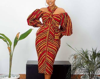 Vestido midi vermelho de festa com estampa africana Ankara e ombros à mostra, ideal para mulheres, com turbante.