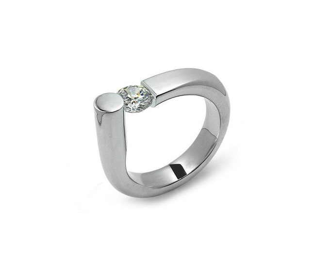 COLONNA Rounded style ring with a off centered tension set white sapphire in stainless steel by Taormina Jewelry