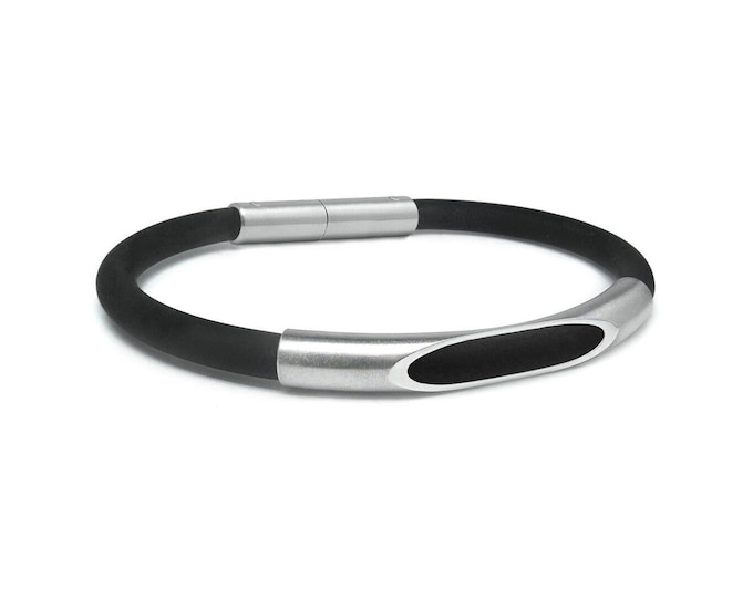 Tubular black rubber bracelet with see through tube element in stainless steel by Taormina Jewelry
