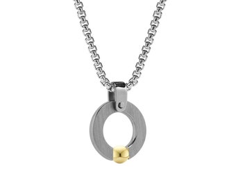 ABBRACCI Flat round pendant with tension set gold sphere in stainless steel by Taormina Jewelry