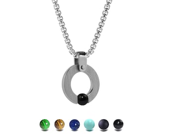 ABBRACCI flat round pendant with tension set semiprecious sphere in stainless steel by Taormina Jewelry