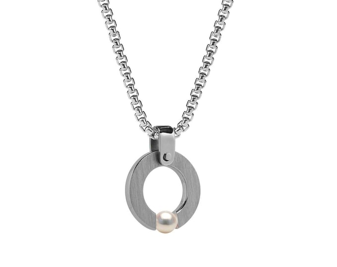 ABBRACCI round flat pendant with tension set white pearl in stainless steel by Taormina Jewelry