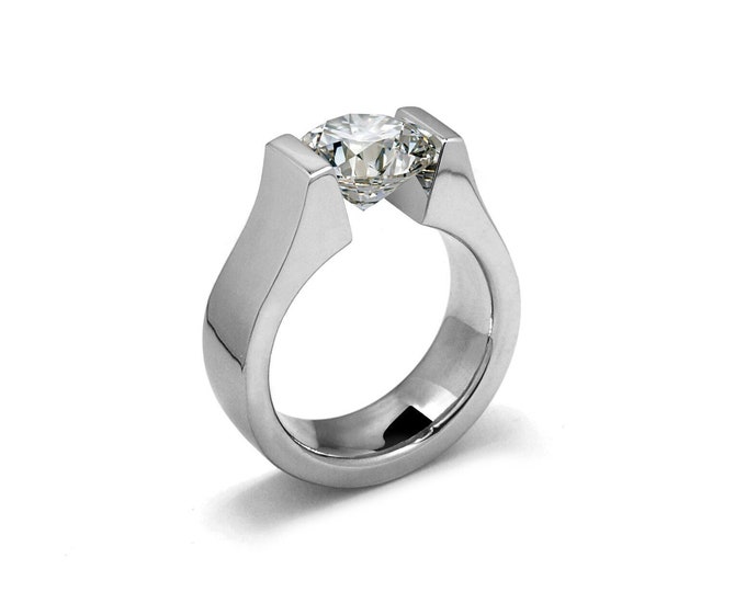 MAREA Flat high setting ring with a tension set white sapphire in stainless steel by Taormina Jewelry