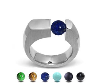 COLONNA Flat top ring with an off centered tension set semiprecious sphere in stainless steel