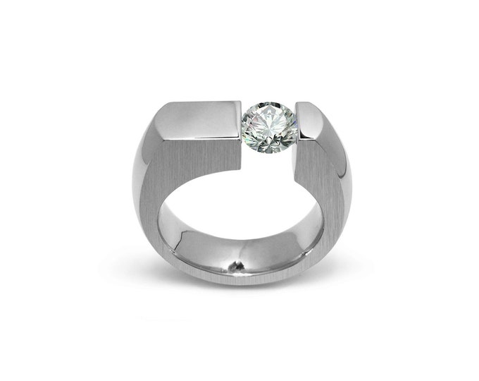 COLONNA Flat style ring with a off centered tension set white sapphire in stainless steel by Taormina Jewelry