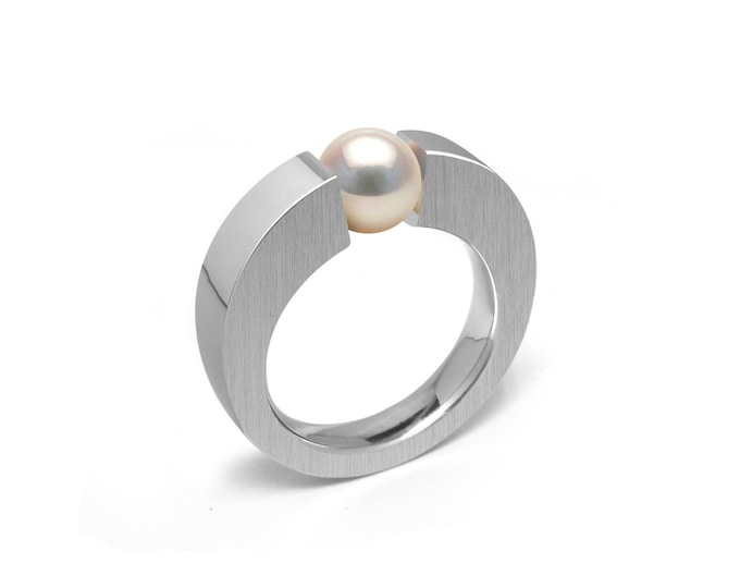 ABBRACCI Two tone flat mounting ring with tension set white pearl in stainless steel by Taormina Jewelry